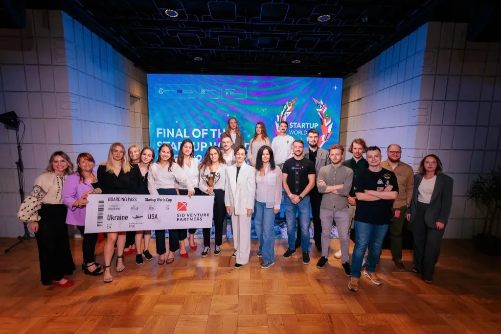 Startup World Cup finalist group on stage